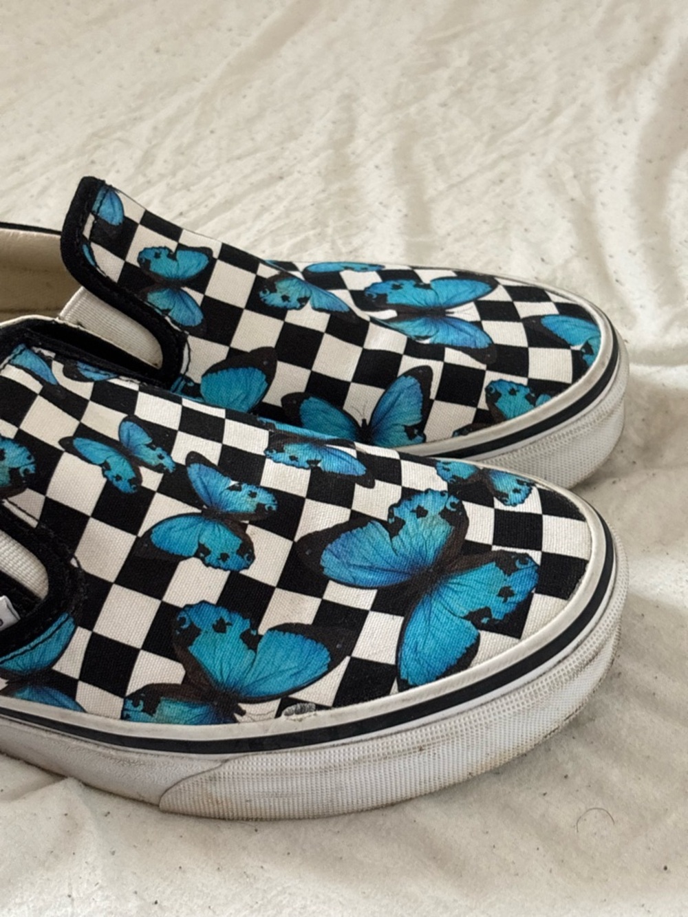 Vans Checkerboard Slip-On Sneakers with Blue Butterfly Print